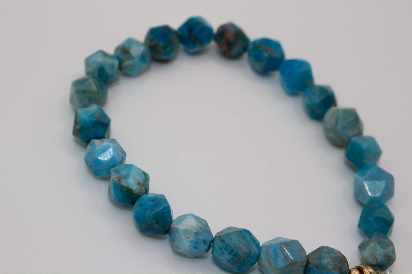 Stretch Turquoise bracelet with gold Buddha charm